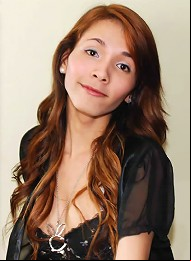 Long haired ladyboy exposes shecock